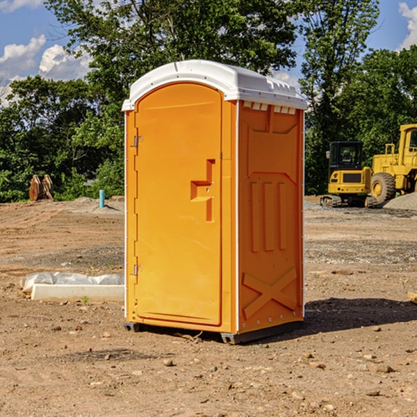 what is the cost difference between standard and deluxe portable toilet rentals in Gerry